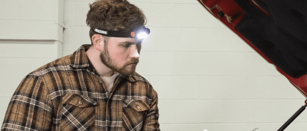 Man wearing his free LED headlamp with AMSOIL purchase